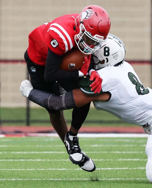 Bridgewater State University receiver Dan Akinsheye makes the catch and is tackled by Plymouth State University defender David Salazar during their game on Saturday , Sept. 16, 2023.