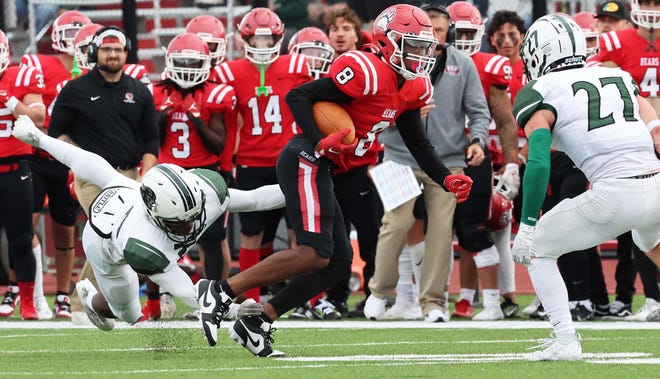 Bridgewater State University receiver Dan Akinsheye makes the catch and is tackled by Plymouth State University defender Luc Normandeau during a game on Saturday , Sept. 16, 2023.