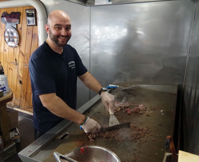 Supreme House of Pizza owner Manny Lambrakis, son of the late founder Jimmy Lambrakis, works the grill to create a steak & cheese sandwich, for which the restaurant is well known. Customers come from all over to have one, and on the day this photograph was made on Tuesday, Nov. 14, 2023, most of the sandwich orders on the phone and in person were for the steak & cheese.