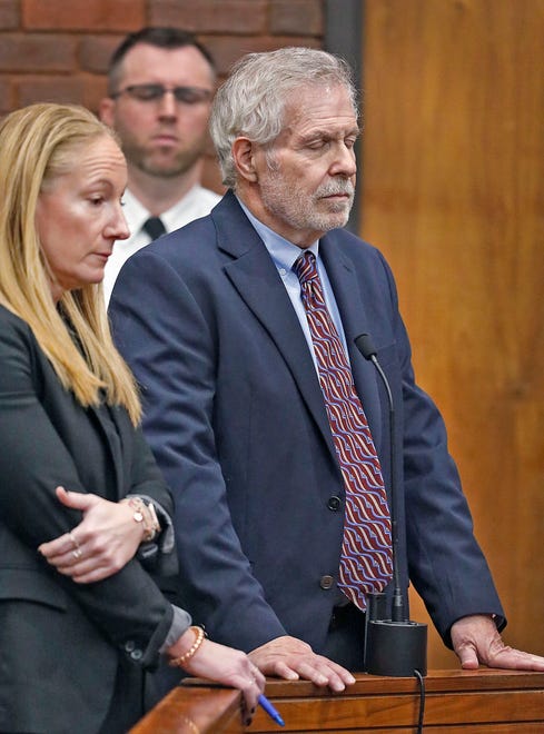 Defense attorney Kelli Porges, left, and her client, Norwell pediatrician Dr. Richard Kauff, listen to the charges during his arraignment in Hingham District Court on Monday, Nov. 20, 2023, on charges of sexual assault as a result of complaints from former patients.