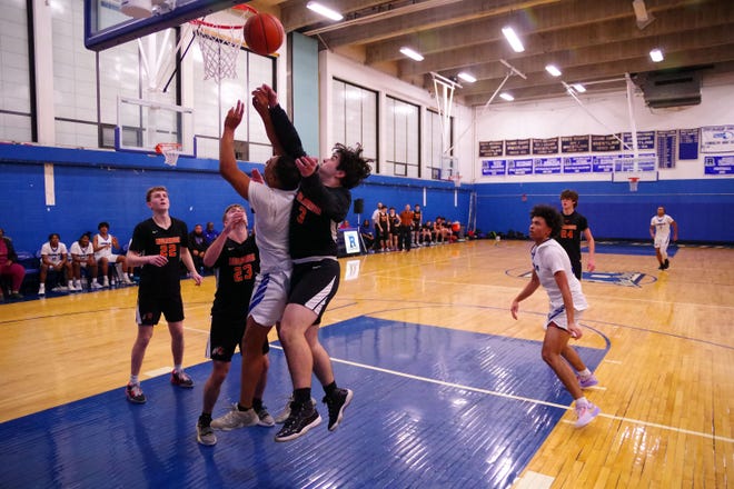 The inside game was big for both teams in the 2nd half, as Randolph's Camden Rainford battles Middleboro's Dyln Covell for a rebound on Friday, Dec. 15, 2023.