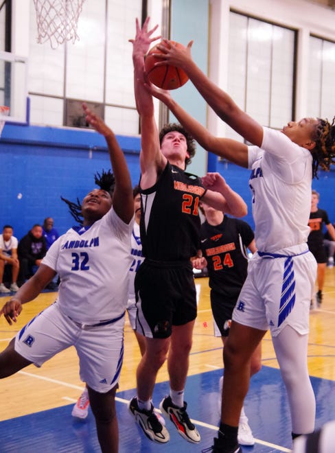 Battles in the paint were intense as both Middleboro and Randolph worked hard for every rebound. Here, Randolph's #32 Jayden Codio and teammate Jordan Nash (R) crash the boards against Middleboro's Brady Roche on Friday, Dec. 15, 2023.