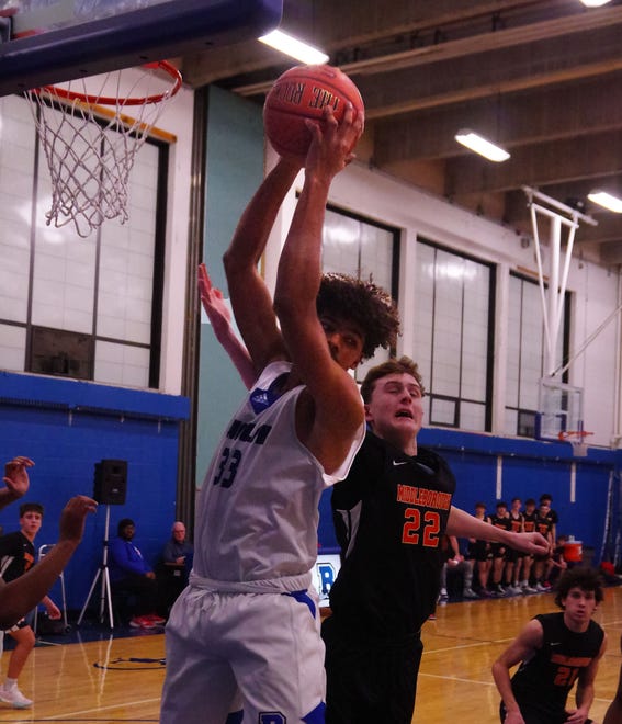 Edgar Furtado #33 of Randolph hauls in a rebound against #22 Matt Youngquist of Middleboro in the first half on Friday, Dec. 15, 2023.