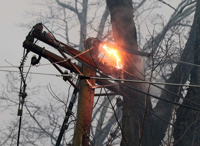 Utility poles and trees were down on Stetson and Pearl streets in Bridgewater during a storm on Monday, Dec. 18, 2023.