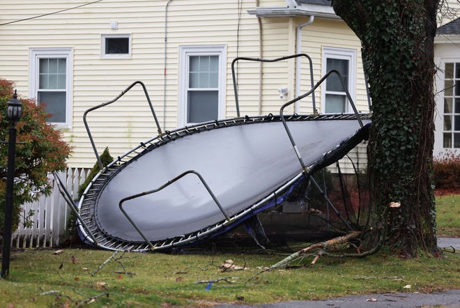 A trampoline blows around on Pearl Street in Bridgewater during a storm on Monday, Dec. 18, 2023.