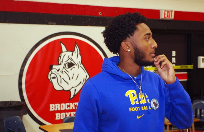 Cameron Monteiro waits in the Brockton High School gym for friends and family to arrive prior to signing his national letter of intent to play football at the University of Pittsburgh on Wednesday, Dec. 20, 2023. Monteiro starts attending Pitt on Jan. 8, 2024, but will return to Brockton in June for BHS graduation.