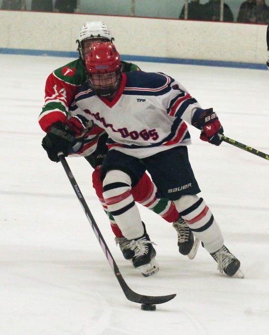 Danny Moran of Rockland fronts Jonathan Halpin of Abington as Alpin tries to get the puck during the game held on Tuesday, Dec. 26, 2023.