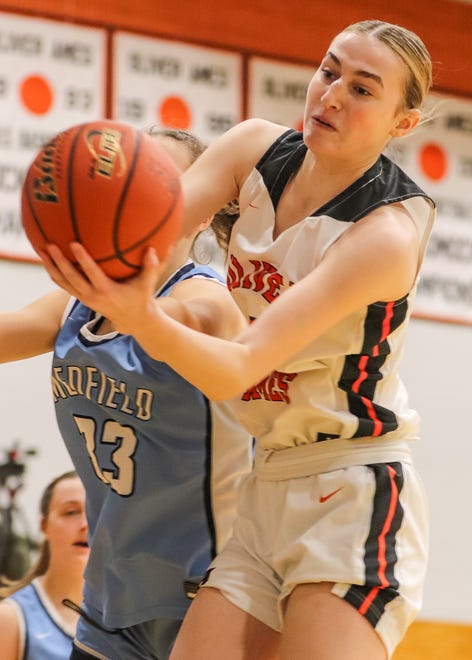 Oliver Ames' Sarah Hilliard grabs a rebound during a game against Medfield at Oliver Ames High School on Friday, Dec. 29, 2023.