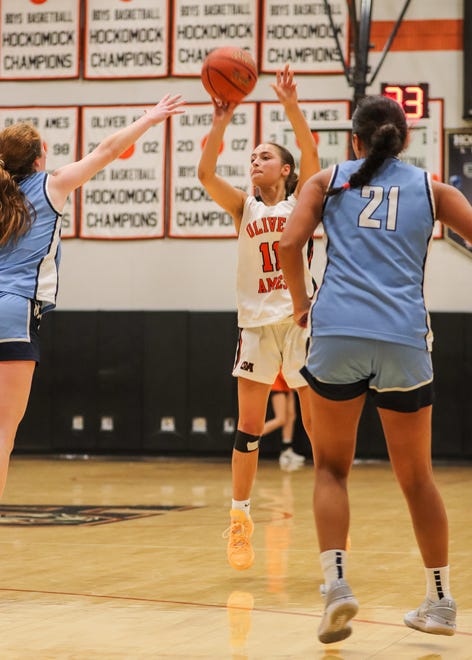 Oliver Ames' Avery Gamble shoots a three-pointer during a game against Medfield at Oliver Ames High School on Friday, Dec. 29, 2023.