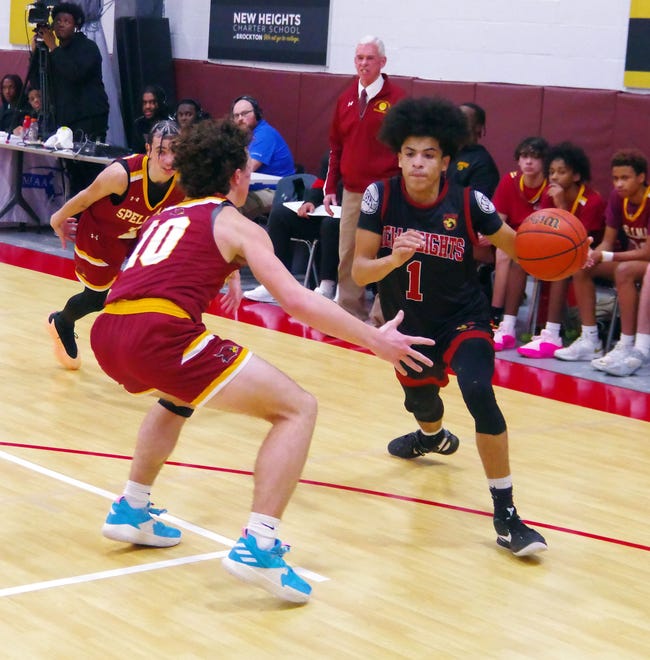 Cardinal Spellman's Matt O'Donnell (#10, left) tries to disrupt New Height's Christian Dalton's path to the basket in first-half action in the basketball game at New Heights on Wednesday, Jan. 3, 2024.