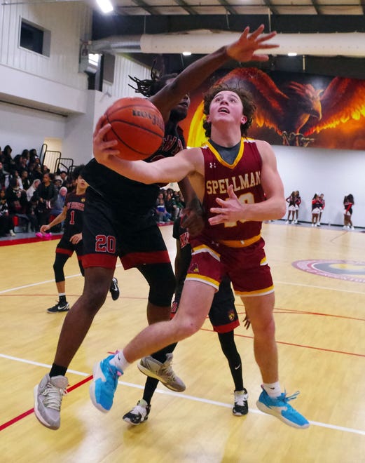 Second-half action sees Matt O'Donnell (R) go up strong to the basket even as New Heights' Khamari Gillings (L) tries to block the shot on Wednesday, Jan. 3, 2024.