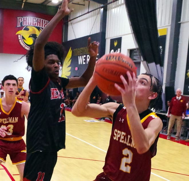 #11 Jaylen Thomas of New Heights looks to stop Jay'von Depina of Cardinal Spellman from advancing in the basketball game held on Wednesday, Jan. 3, 2024.