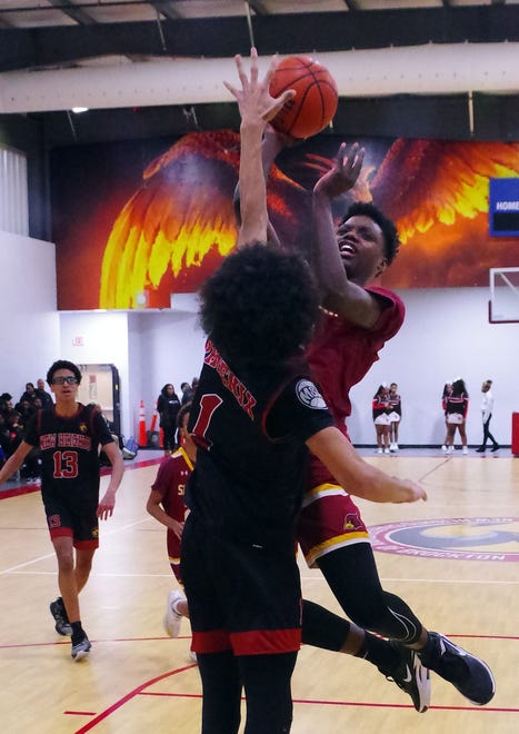 #1 of New Heights Christian Dalton looks to stop Cardinal Spellman's Joey Efian in the 2nd half on Wednesday, Jan. 3, 2024.