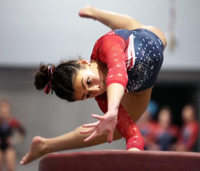 Bridgewater-Raynham/West Bridgewater's Lily Moreira competes in the vault routine at Spectrum Gymnastics on Saturday, Jan. 13, 2024.