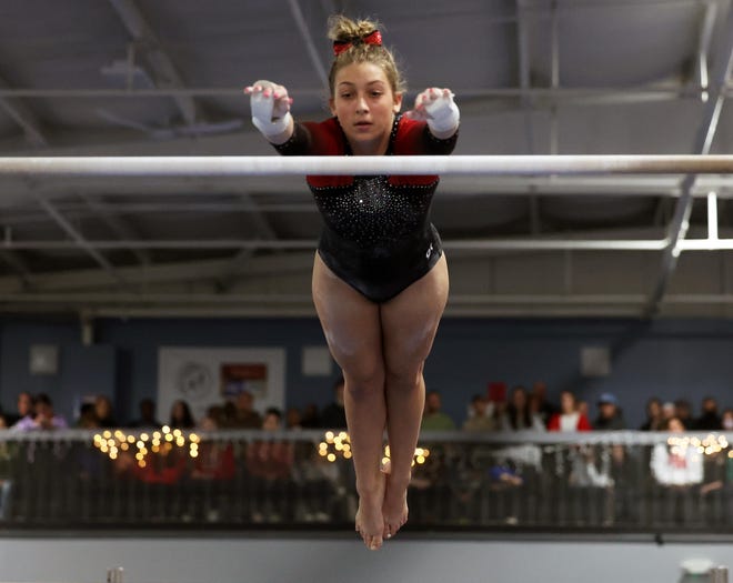 Brockton/Cardinal Spellman/East Bridgewater's Chloe Lavigne competes in the bars routine at Spectrum Gymnastics on Saturday, Jan. 13, 2024.