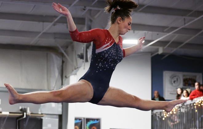 Bridgewater-Raynham/West Bridgewater's Lily Moreira competes in the beam event at Spectrum Gymnastics on Saturday, Jan. 13, 2024.