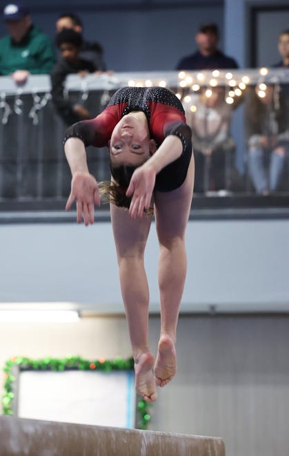 Brockton/Cardinal Spellman/East Bridgewater's Ciara Thomas competes in the beam event at Spectrum Gymnastics on Saturday, Jan. 13, 2024.