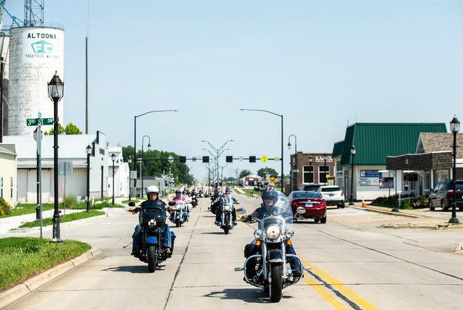 U.S. Sen. Joni Ernst, R-Iowa, right, and former Vice President Mike Pence ride motorcycles during the annual Roast and Ride fundraiser, Saturday, June 3, 2023, in Altoona, Iowa.